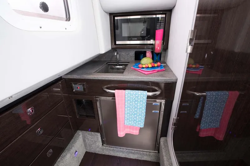 Slide: The Image of 2018 Formula 350 Crossover Bowrider cockpit with sleek dashboard and luxurious seating. - 7