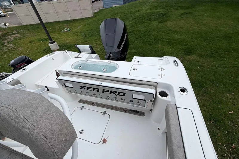 Slide: The Image of 2023 Sea Pro 219 Center Console boat with outboard motor, featuring spacious seating and storage. - 12