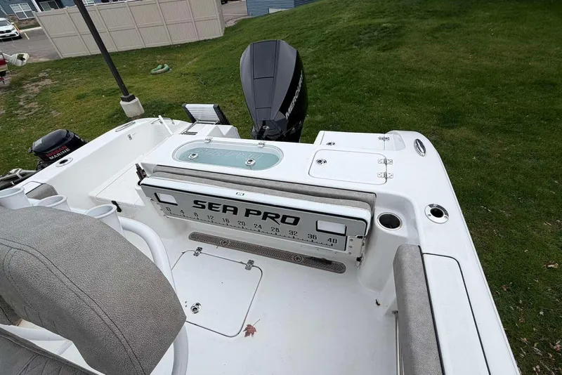 Slide: The Image of 2023 Sea Pro 219 Center Console boat with Mercury engine, featuring spacious seating and storage. - 13