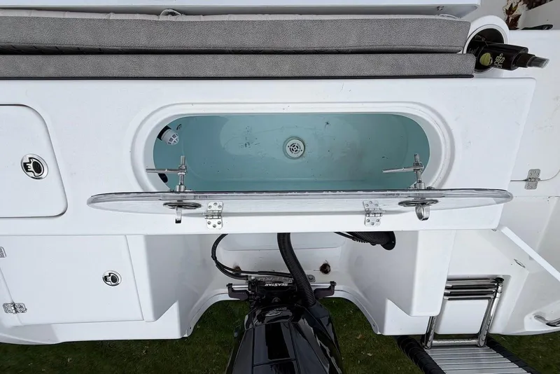 Slide: The Image of 2023 Sea Pro 219 Center Console boat with open livewell and motor view. - 15