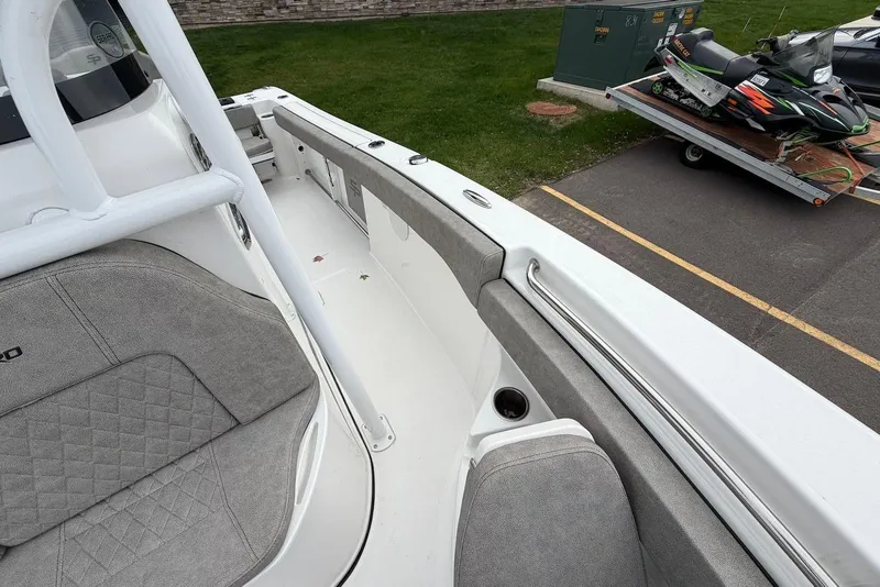Slide: The Image of 2023 Sea Pro 219 Center Console boat interior with gray seating and white deck. - 38