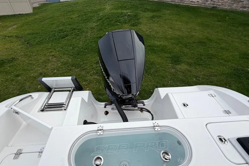 Slide: The Image of 2023 Sea Pro 219 Center Console boat with outboard motor and swim ladder. - 43