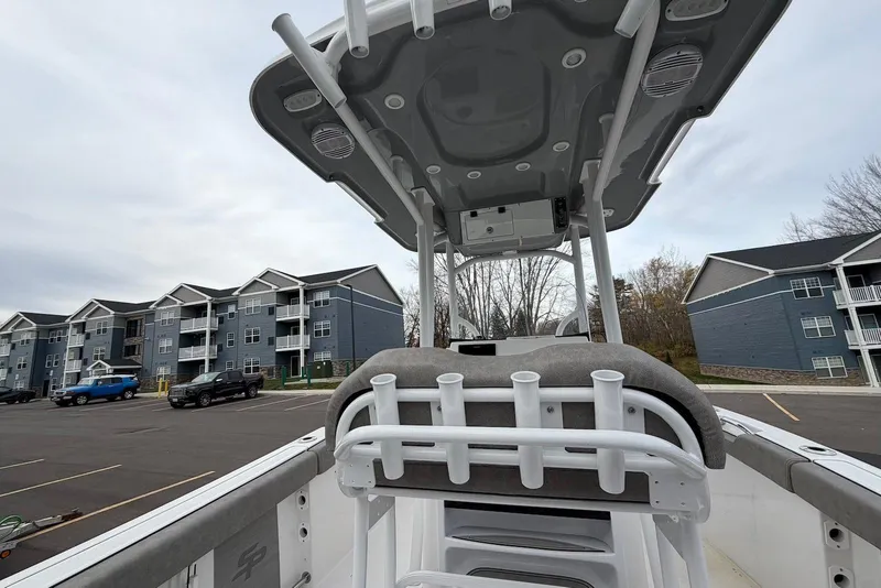 Slide: The Image of 2023 Sea Pro 219 Center Console boat in a parking lot near residential buildings. - 48