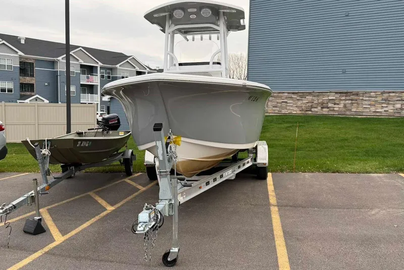 Slide: The Image of 2023 Sea Pro 219 Center Console boat on trailer in parking lot. - 5