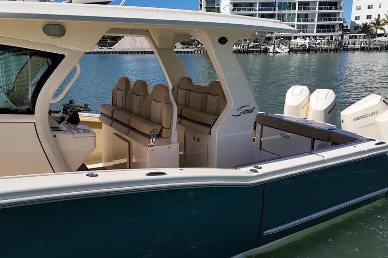 Slide: The Image of 2024 Scout 425 LXF luxury boat with sleek design and comfortable seating. - 6