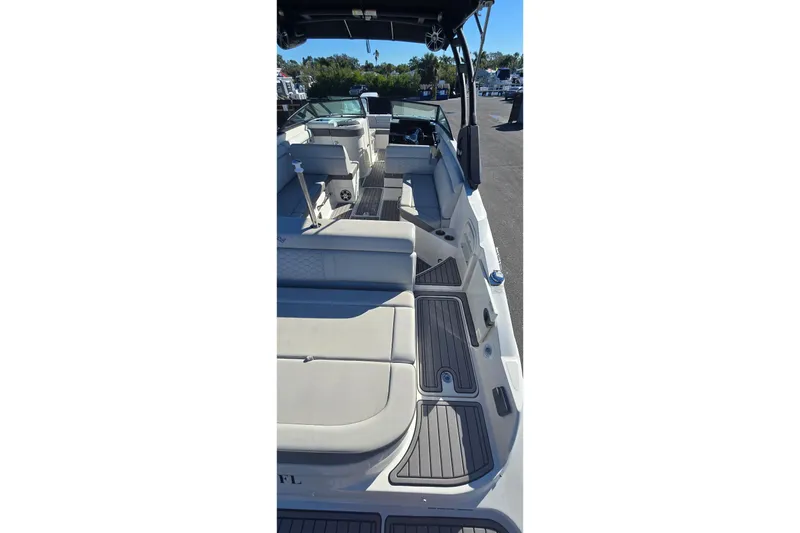 Slide: The Image of 2023 Sea Ray SDX 270 Outboard boat interior with spacious seating and modern design. - 14