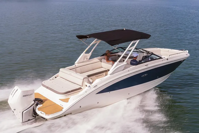 Slide: The Image of 2023 Sea Ray SDX 270 Outboard boat on trailer, black and white design, clear blue sky. - 2