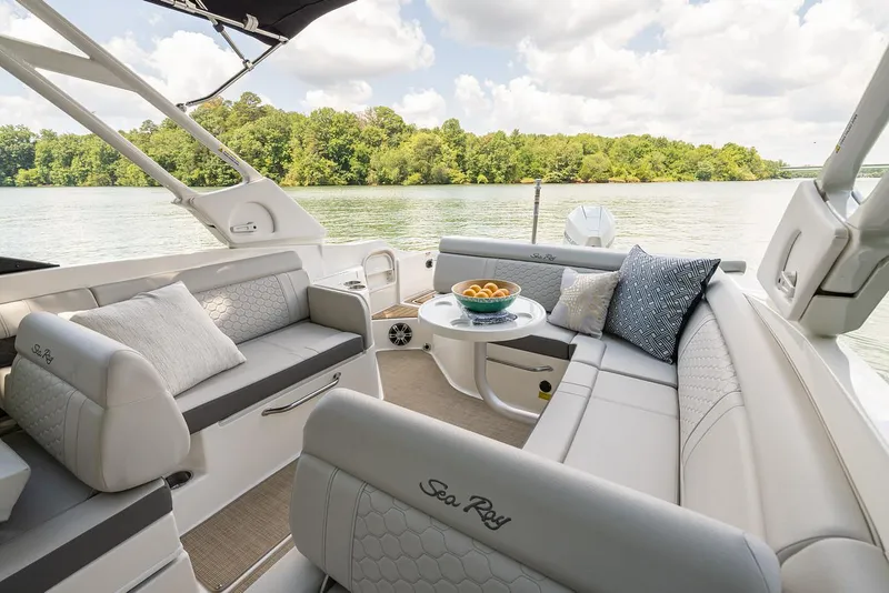 Slide: The Image of Manufacturer Provided Image: 2023 Sea Ray SDX 270 Outboard boat interior with plush seating and scenic lake view. - 24