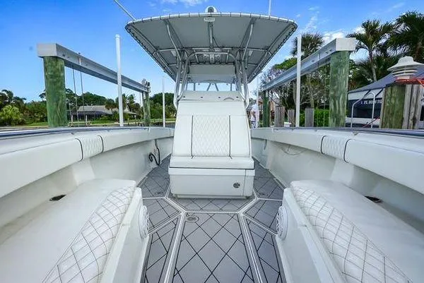 Slide: The Image of 2007 Spectre 37 Center Console boat cockpit with modern navigation equipment and sleek design. - 16