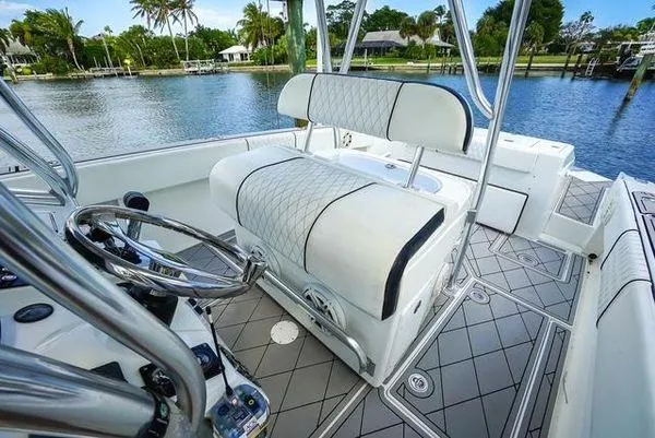Slide: The Image of 2007 Spectre 37 Center Console boat cockpit with navigation system and steering wheel. - 19