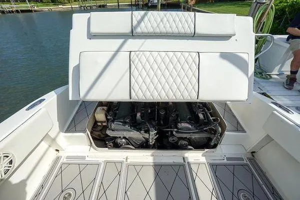 Slide: The Image of Luxurious interior of 2007 Spectre 37 Center Console boat with white quilted seating. - 25