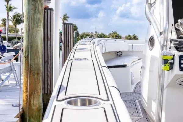 Slide: The Image of 2007 Spectre 37 Center Console boat with radar equipment, set against a clear blue sky. - 33