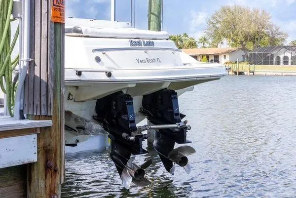 Slide: The Image of 2007 Spectre 37 Center Console boat docked by water. - 34