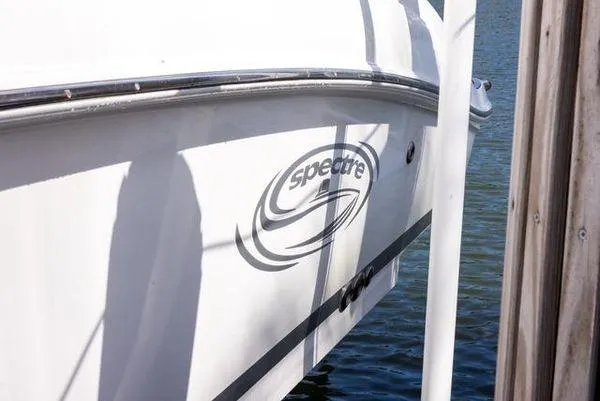 Slide: The Image of 2007 Spectre 37 Center Console boat interior with compact marine toilet. - 36