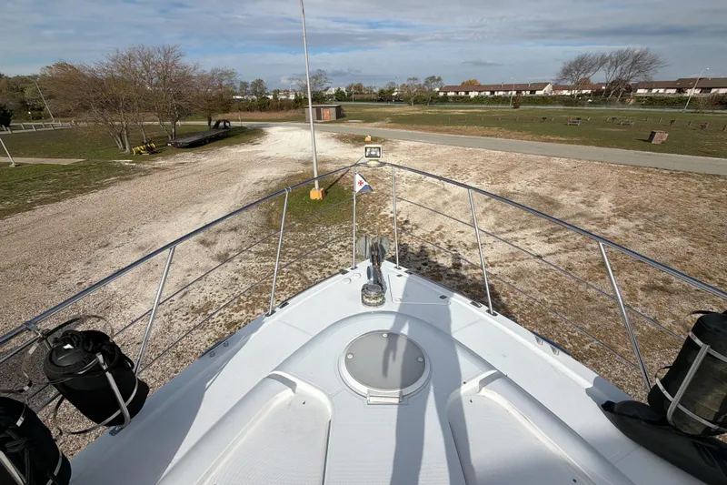 Slide: The Image of Luxurious interior of 2003 Carver 564 Cockpit Motor Yacht with cozy seating and elegant decor. - 25