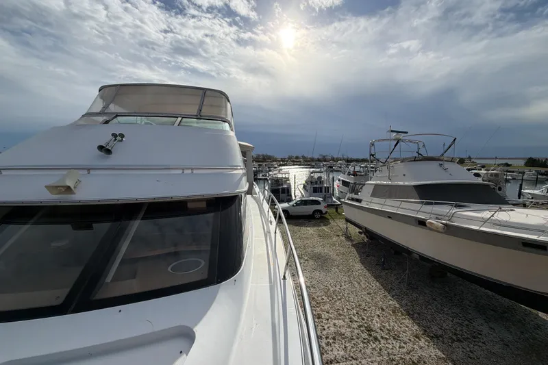 Slide: The Image of Luxurious interior of 2003 Carver 564 Cockpit Motor Yacht with leather seating and elegant decor. - 26