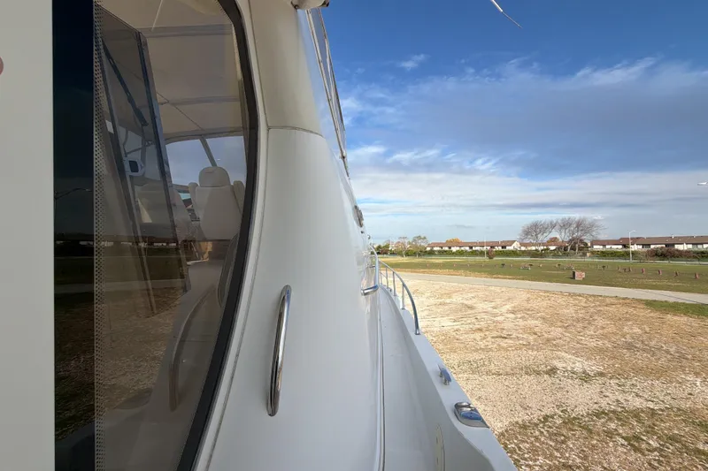 Slide: The Image of Interior view from the helm of a 2003 Carver 564 Cockpit Motor Yacht. - 31
