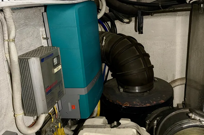 Slide: The Image of Engine room of 2003 Carver 564 Cockpit Motor Yacht with electrical components. - 49