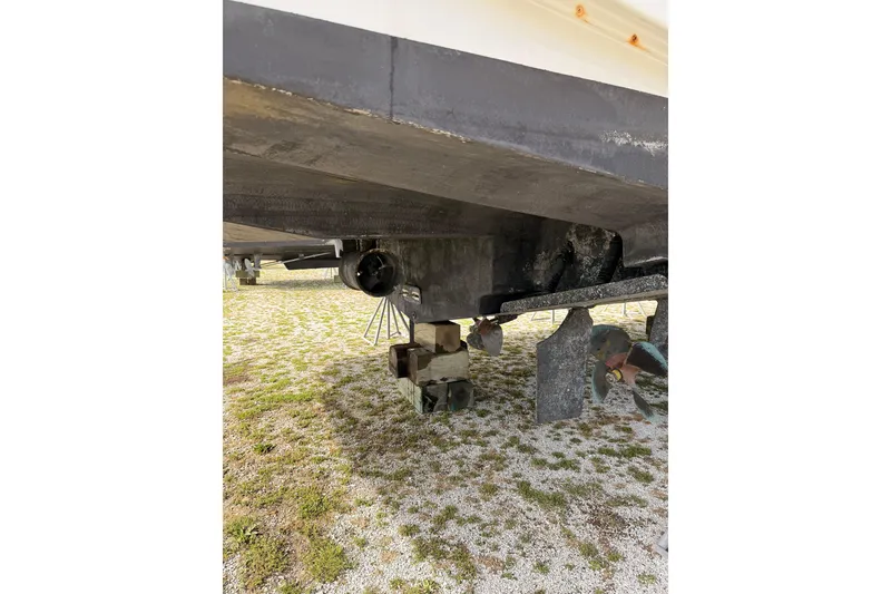 Slide: The Image of Underside view of a 2003 Carver 564 Cockpit Motor Yacht on blocks. - 5