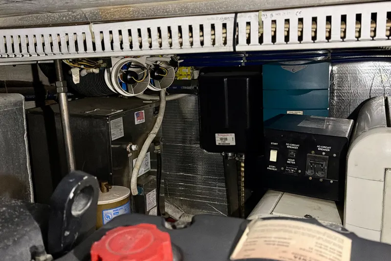 Slide: The Image of Engine room of 2003 Carver 564 Cockpit Motor Yacht with electrical components and wiring. - 50
