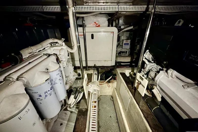 Slide: The Image of Engine room of 2003 Carver 564 Cockpit Motor Yacht, showcasing machinery and components. - 55