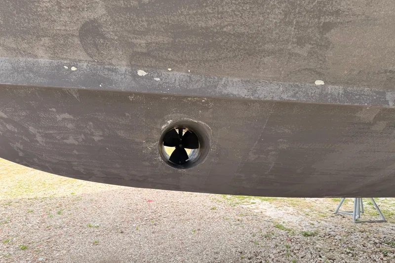 Slide: The Image of 2003 Carver 564 Cockpit Motor Yacht hull with visible thruster. - 2