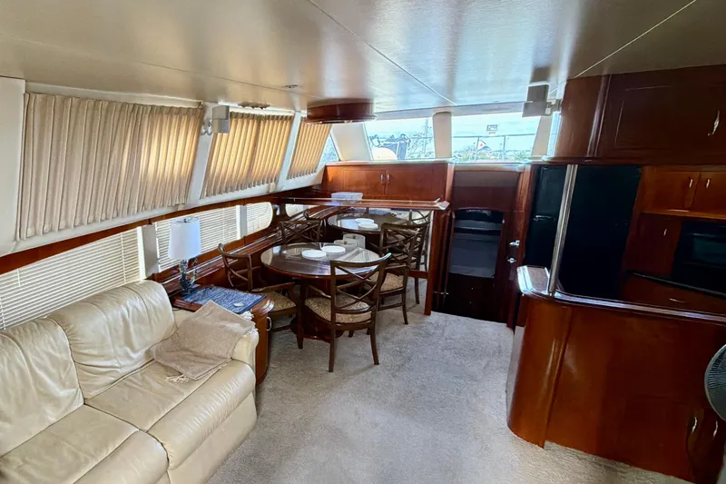 Slide: The Image of Luxurious interior of 2003 Carver 564 Cockpit Motor Yacht with elegant furnishings. - 21