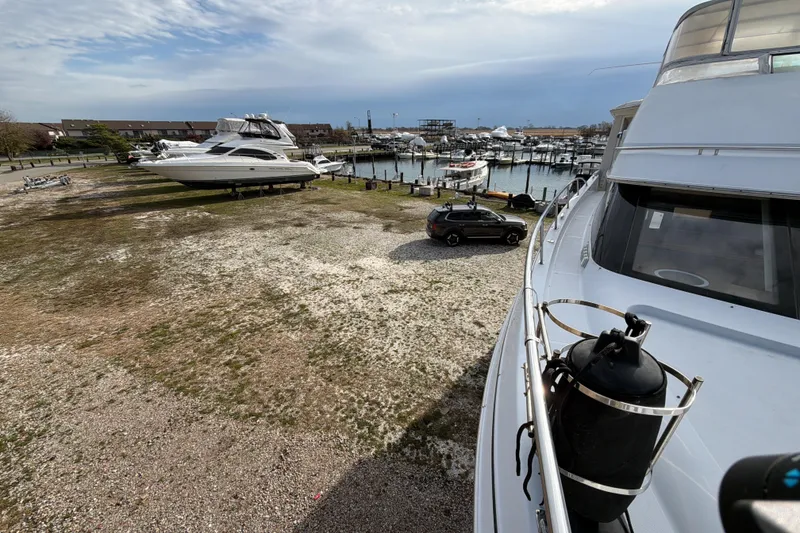 Slide: The Image of Luxurious interior of 2003 Carver 564 Cockpit Motor Yacht with leather seating and elegant decor. - 27