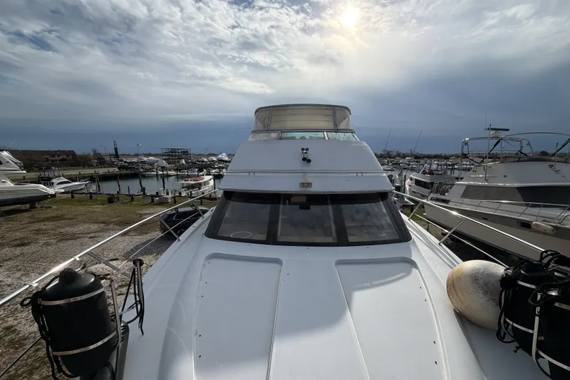 Slide: The Image of Electrical panel inside 2003 Carver 564 Cockpit Motor Yacht, with cozy seating area. - 28