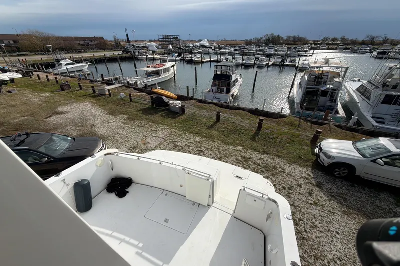 Slide: The Image of Interior of 2003 Carver 564 Cockpit Motor Yacht with table, chairs, and lamp. - 29