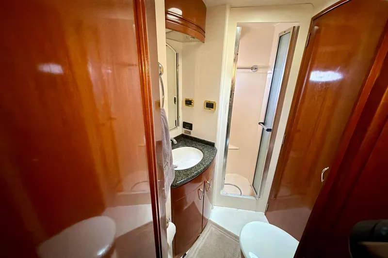 Slide: The Image of Luxurious bathroom in 2003 Carver 564 Cockpit Motor Yacht with shower and vanity. - 35