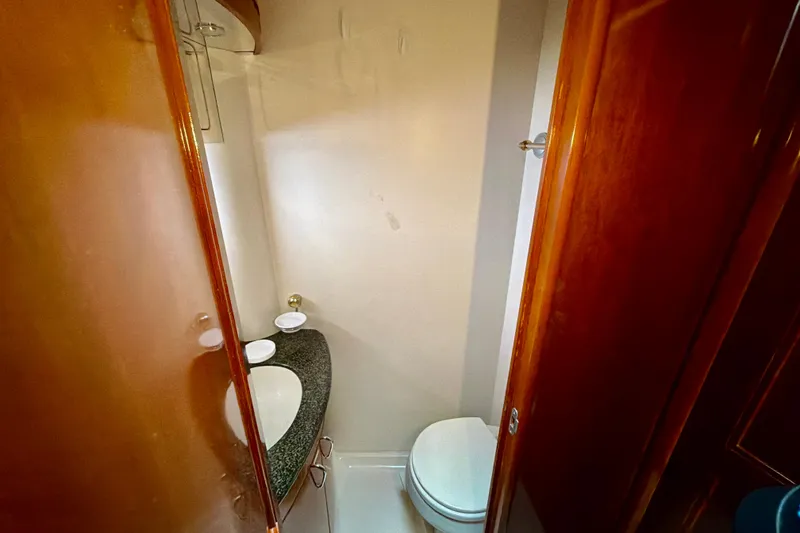 Slide: The Image of 2003 Carver 564 Cockpit Motor Yacht bathroom with sink and toilet. - 37