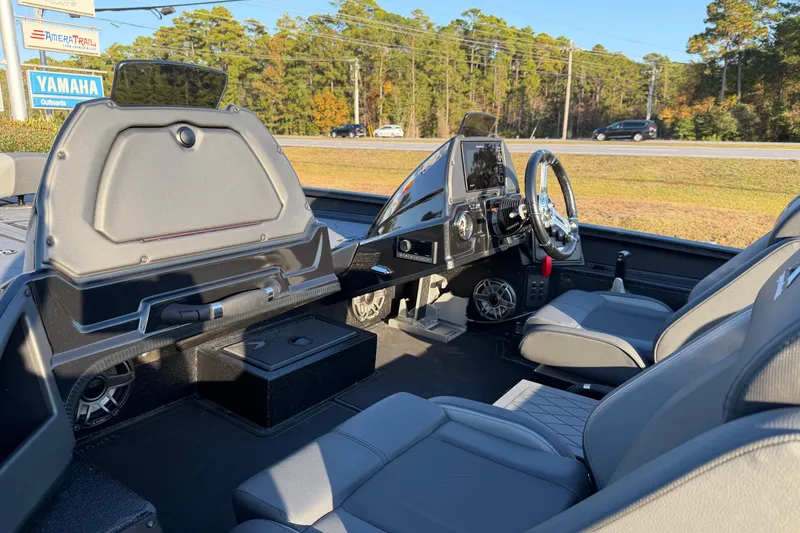 Slide: The Image of Interior of 2025 Xpress X21 Pro boat with modern dashboard and seating. - 13