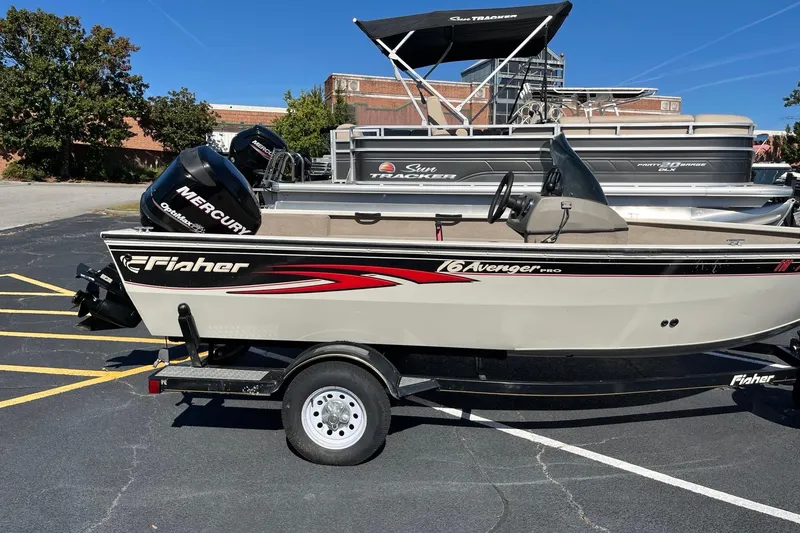 Slide: The Image of 2008 Fisher 160 Pro Avenger SC boat with Mercury engine on trailer. - 3