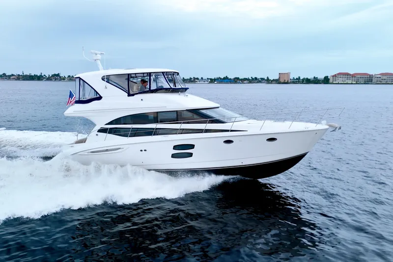 The Image of 2013 Meridian 441 Sedan yacht cruising on open water. - 0