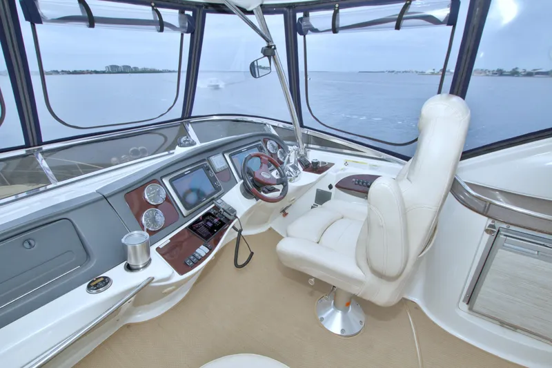 Slide: The Image of Helm of 2013 Meridian 441 Sedan yacht with luxurious seating and navigation equipment. - 15