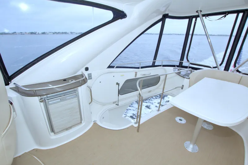 Slide: The Image of 2013 Meridian 441 Sedan interior with table, seating, and ocean view. - 22