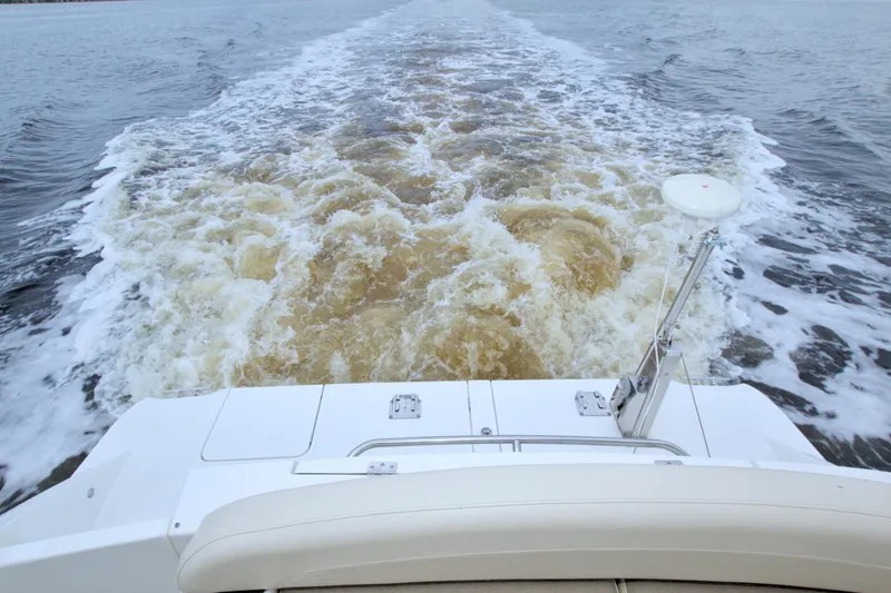 Slide: The Image of Wake behind a 2013 Meridian 441 Sedan yacht cruising on open water. - 24