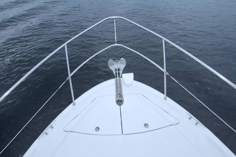 Slide: The Image of Bow view of 2013 Meridian 441 Sedan yacht on calm water. - 30