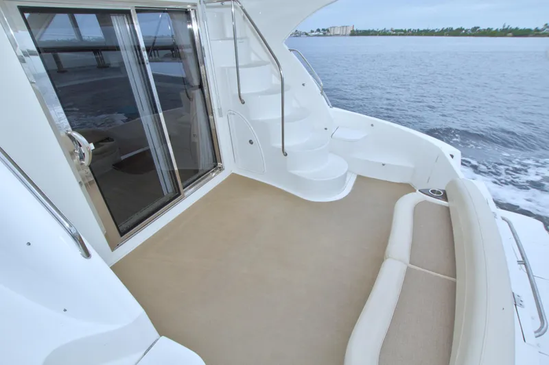 Slide: The Image of 2013 Meridian 441 Sedan yacht deck with seating and ocean view. - 36