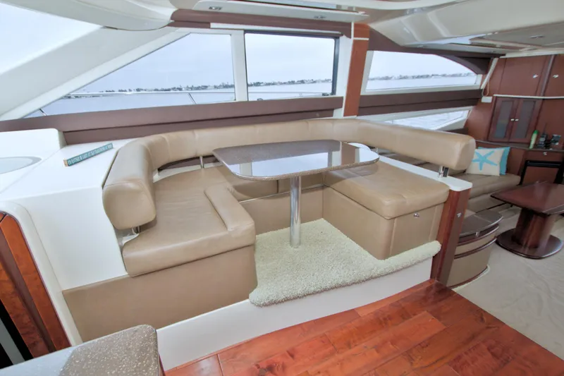 Slide: The Image of Luxurious interior of 2013 Meridian 441 Sedan yacht with leather seating and panoramic windows. - 40