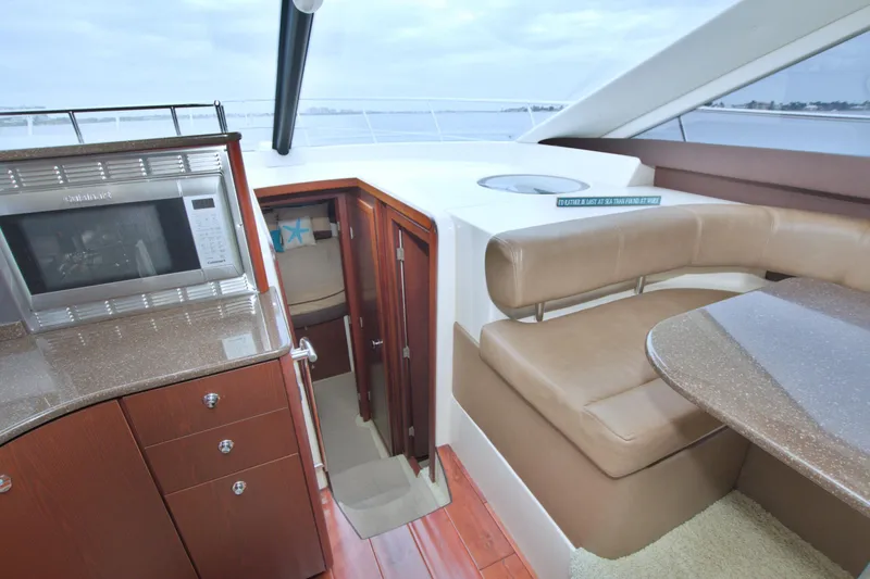 Slide: The Image of Luxurious interior of 2013 Meridian 441 Sedan yacht with modern kitchen and seating area. - 43
