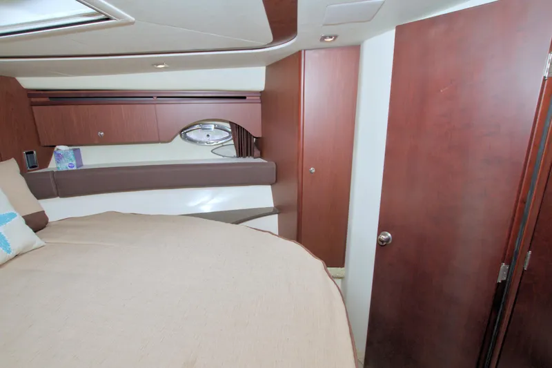 Slide: The Image of Luxurious interior of 2013 Meridian 441 Sedan yacht cabin with wood finishes. - 45