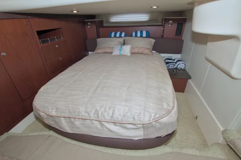 Slide: The Image of Luxurious bedroom interior of 2013 Meridian 441 Sedan yacht with cozy bedding. - 54
