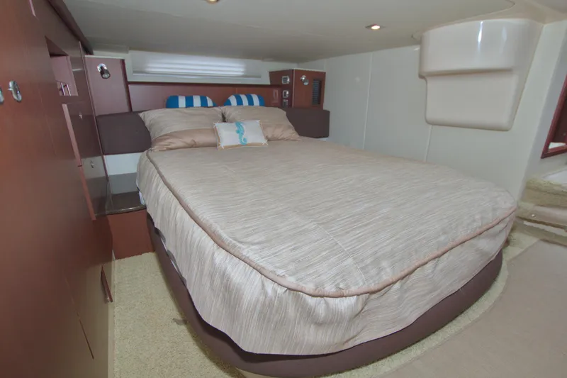 Slide: The Image of Luxurious bedroom interior of 2013 Meridian 441 Sedan yacht with cozy bedding. - 55