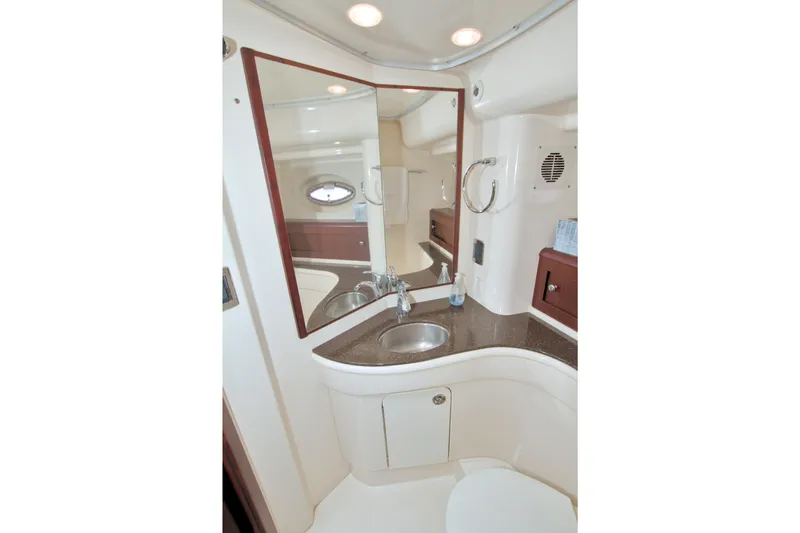Slide: The Image of Bathroom interior of 2013 Meridian 441 Sedan yacht, featuring sink and mirror. - 58