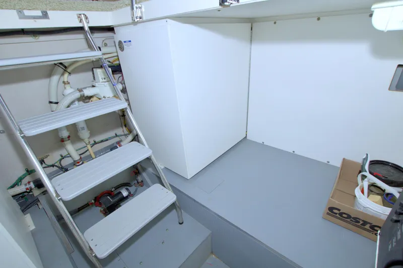 Slide: The Image of Engine room of 2013 Meridian 441 Sedan yacht with ladder and storage. - 64