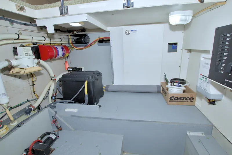 Slide: The Image of Engine room of 2013 Meridian 441 Sedan yacht with equipment and wiring. - 65
