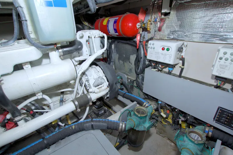 Slide: The Image of Engine room of 2013 Meridian 441 Sedan with mechanical components and fire extinguisher. - 73
