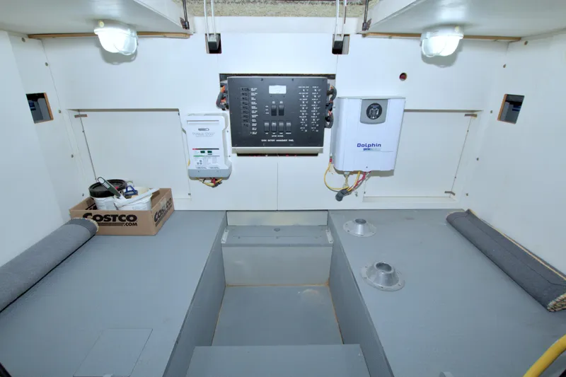 Slide: The Image of Engine room of 2013 Meridian 441 Sedan with control panel and storage. - 74